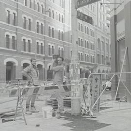 Workmen involved in the footpath upgrade program, Liverpool and Kent Streets Sydney, 1999