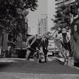 Workmen involved on the footpath upgrade project, Martin Place and Castlereagh Street Sydney, 2000