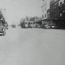 Cars and trams at the intersection of Riley and Oxford Street Darlinghurst, 1929