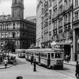 Trams passing Yorkshire House, Spring Street Sydney, 1954