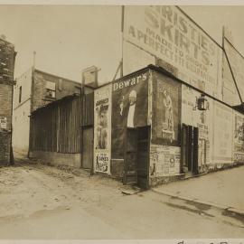 Print - Advertising posters along Campbell Street Surry Hills, 1909
