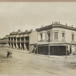 Print - Streetscape with terrace houses and Donovans Furniture Store, corner of Quay and Engine Streets Haymarket, 1910
