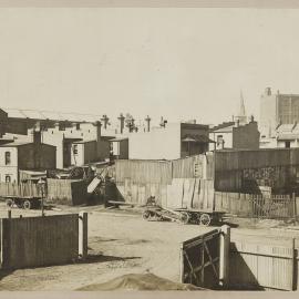 Print - Streetscape with buildings to be resumed on Quay Street Haymarket, 1910