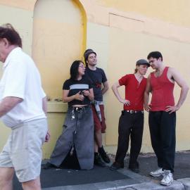 Four friends chatting next to a yellow wall, Glebe Point Road Glebe, 2004
