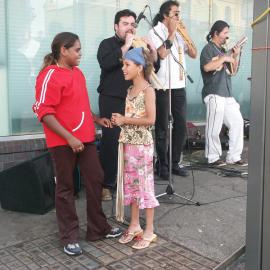 Two girls and busking musicians, Glebe Point Road Glebe, 2003