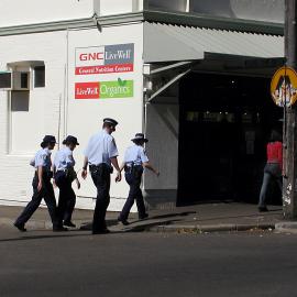 Four police officers crossing the road, Glebe Point Road Glebe, 2002
