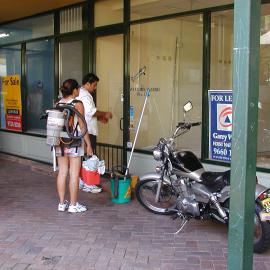 Two cleaners standing outside a shop for lease, Glebe Point Road Glebe, 2002