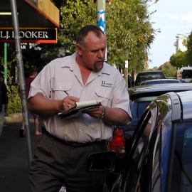 A parking officer issuing a parking ticket, Glebe Point Road Glebe, 2002