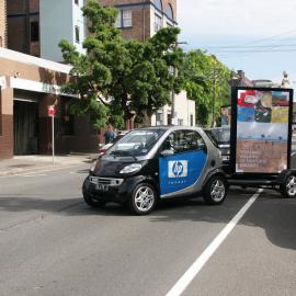 Car pulling mobile advertising, Glebe Point Road Glebe, 2003