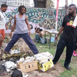 Cooking over the earth oven, farewell to Auntie Joyce Ingram, Eveleigh Street Redfern, 2004