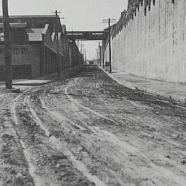 Muddy road surface, prior to the reconstruction of Bowman Street, Pyrmont, 1932