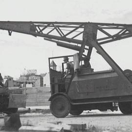 Workmen and crane near the Bradfield Highway, Millers Point, 1942
