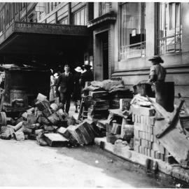 Building materials and pedestrians on Castlereagh Street Sydney, 1935