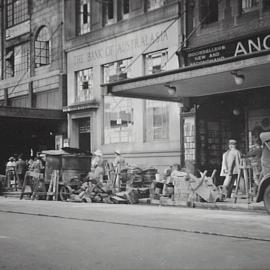 Building materials and pedestrians on Castlereagh Street Sydney, 1935