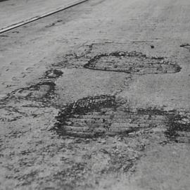 Damaged road surface, Castlereagh Street Sydney, 1932