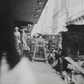 Road building materials on Castlereagh Street Sydney, 1935