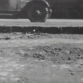 Damaged road surface, Castlereagh Street Sydney, 1932