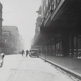 Cyclists and cars on Castlereagh Street Sydney, 1932