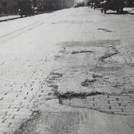 Damaged road surface, Castlereagh Street Sydney, 1932