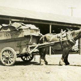 Horse drawn garbage cart No. 16 with driver at unknown location, circa 1930