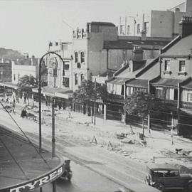 Looking north east at roadworks on Flinders Street Darlinghurst, 1929