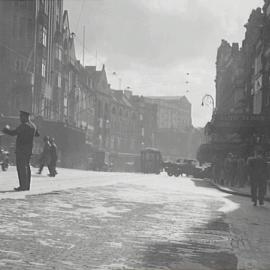 George Street before resurfacing, pedestrians, and trams, Bridge Street Sydney, 1932