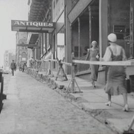 Pedestrians walking west towards York Street beside roadworks, Margaret Street Sydney, Sydney, 1933