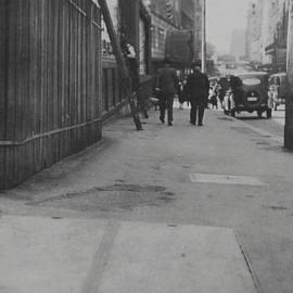 Footpath condition prior to reconstruction, Market Street Sydney, 1932