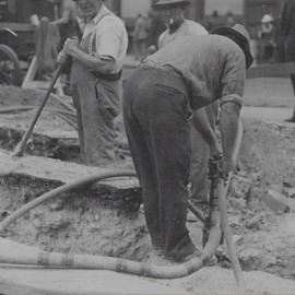 Workman using jackhammer on Martin Place extension, Martin Place Sydney, 1934