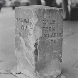 Closeup of historic milestone, corner George and Liverpool Streets, 1954