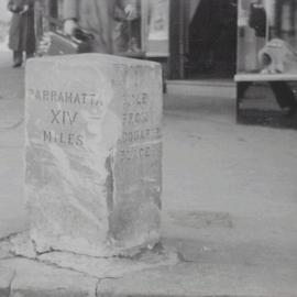 Closeup of historic milestone, corner George and Liverpool Streets, 1954