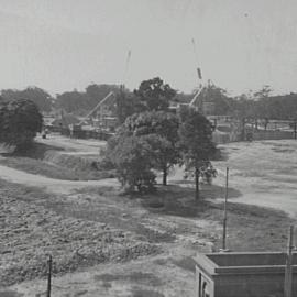 Elevated view of construction in Hyde Park South, Elizabeth and Liverpool Street Sydney, 1932