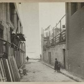 Print - Laneway with rear of buildings, Clarence Lane Sydney, 1921