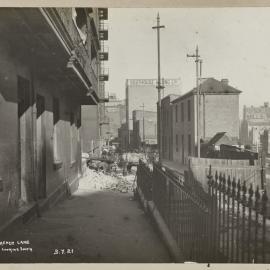 Print - Streetscape demolition work and buildings, Clarence Lane Sydney, 1921