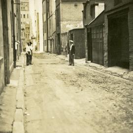 Men standing in Phillip Lane Sydney, 1930