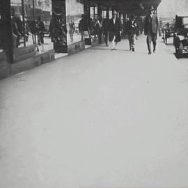 Pedestrians on new footpath, corner Pitt and Park Streets Sydney, 1929