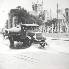 Street flushing Lorry washing the street, Queens Square Sydney, 1920
