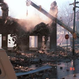 Crane demolishing Nock & Kirby building after fire, Pitt Street Redfern, 1985