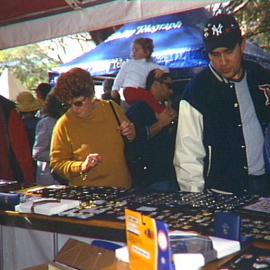 Pin collecting at stalls at Hyde Park North, Sydney, 2000