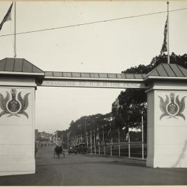 Print - Welcome gate and street decorations for Royal Visit, College Street Sydney, 1920