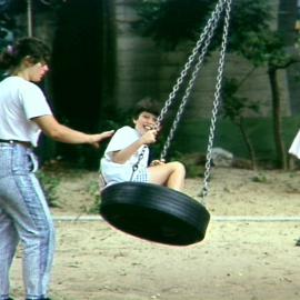 Playing on a swing at King George V Recreation Centre, Cumberland Street The Rocks, 1990