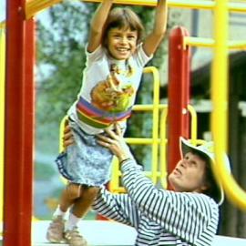 Child on play equipment at King George V Recreation, Cumberland Street Centre The Rocks, 1990