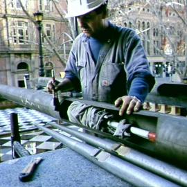 Workman restoring the Sydney Town Hall Grand Organ pipes, George Street Sydney, 1991