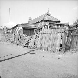 Dilapidated house and fence, corner of Edward Street and Eglington Lane Glebe, 1951