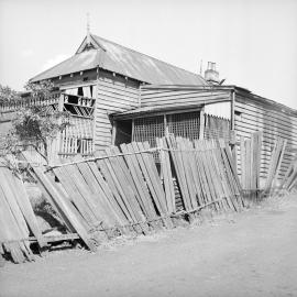 Dilapidated house and fence, corner of Edward Street and Eglington Lane Glebe, 1951
