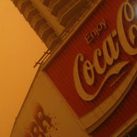 Coca-Cola billboard and Zenith Residences in Kings Cross during dust storm in Sydney, 2009