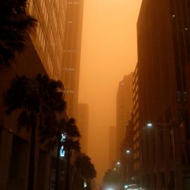 City buildings in the orange haze of an early morning dust storm, Phillip Street Sydney, 2009