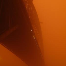 Sydney Harbour Bridge from Dawes Point, in the orange haze of an early morning dust storm, 2009