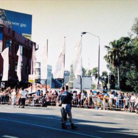 Spectators waiting for the Gay & Lesbian Mardi Gras Parade (SGLMG), Darlinghurst, 2002