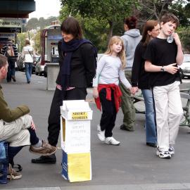 Buskers, storyteller sitting on an upturned milk crate, Glebe Point Road Glebe, 2004